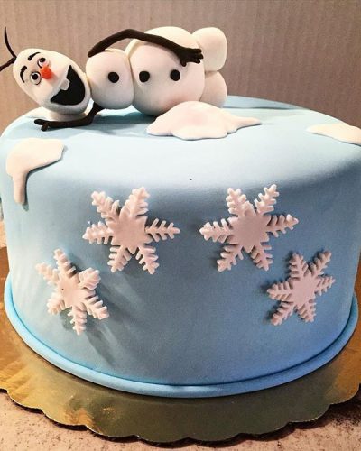 Custom Frozen themed cake with Olaf fondant figure and snowflake decorations, Mia's Brooklyn Bakery NYC
