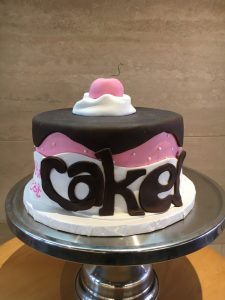 Custom fondant novelty cake with pink and black decoration, Mia's Brooklyn Bakery NYC