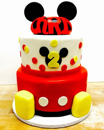Custom two-tier Mickey Mouse second birthday cake with red and yellow fondant decoration, Mia's Brooklyn Bakery NYC
