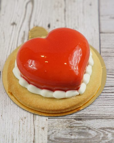 savor the classic flavor of a raspberry tart at Mia's Bakery.