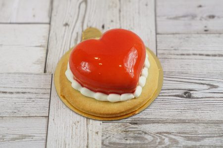 savor the classic flavor of a raspberry tart at Mia's Bakery.