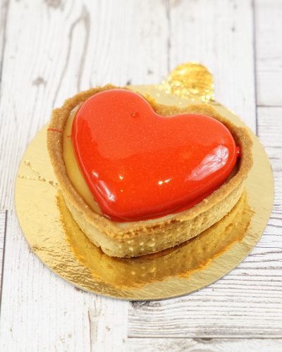 savor the classic flavor of a lemon raspberry tart at Mia's Bakery.