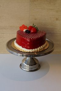 Chocolate raspberry cake with red glaze, heart decorations, and fresh berries, Mia's Brooklyn Bakery NYC