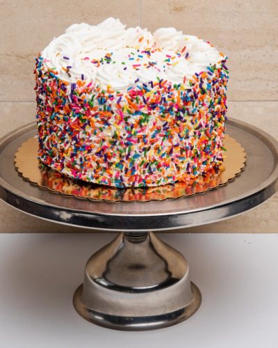 savor the classic flavor of a traditional rainbow cake at Mia's Bakery.
