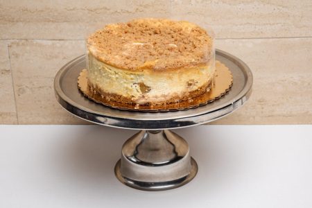 savor the classic flavor of a traditional New York style apple cheesecake at Mia's Bakery.