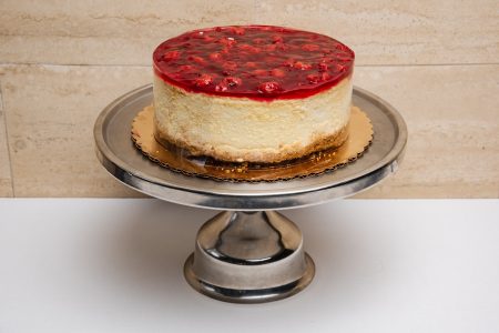 savor the classic flavor of a traditional New York style cherry cheesecake at Mia's Bakery.