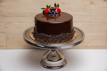 savor the classic flavor of a traditional chocolate layer cake at Mia's Bakery.