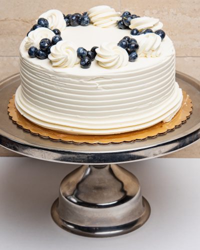 savor the classic flavor of a traditional lemon blueberry cake at Mia's Bakery.