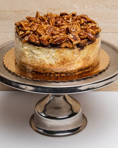 savor the classic flavor of a traditional New York style pecan pie cheesecake at Mia's Bakery.