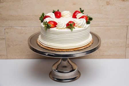 savor the classic flavor of a homemade strawberry shortcake cake at Mia's Bakery.