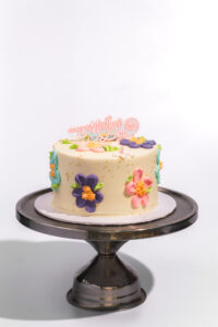 savor the classic flavor of a flower cake at Mia's Bakery.