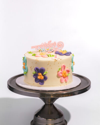 savor the classic flavor of a flower cake at Mia's Bakery.