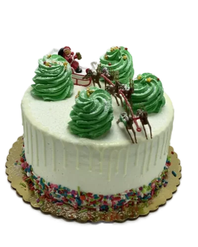 Christmas cake with Santa sleigh topper, green buttercream trees, and reindeer decorations, Mia's Brooklyn Bakery NYC