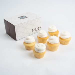 savor the classic flavor of traditional vanilla cupcakes at Mia's Bakery.