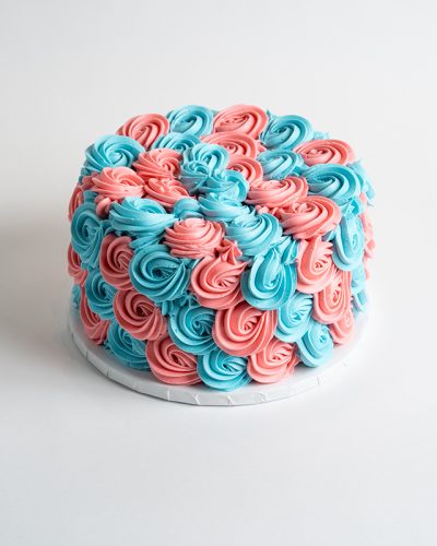 savor the classic flavor of a pink and blue rosette gender reveal at Mia's Bakery.