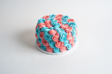 savor the classic flavor of a pink and blue rosette gender reveal at Mia's Bakery.