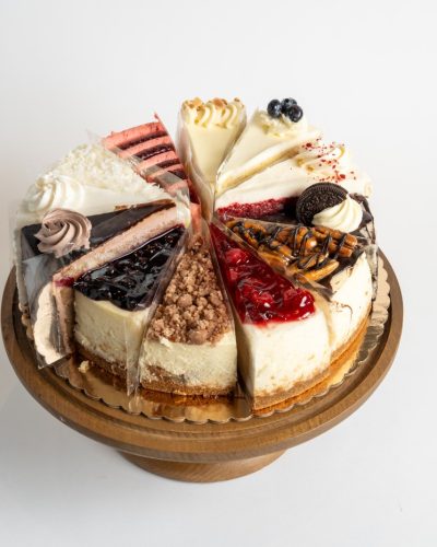 Mystery Cake Platter featuring 8 premium cake slices and 4 rich cheesecake varieties from Mia's Bakery.