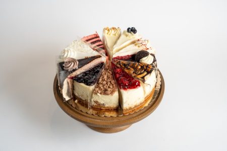 Mystery Cake Platter featuring 8 premium cake slices and 4 rich cheesecake varieties from Mia's Bakery.