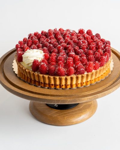 savor the classic flavor of a Lemon Raspberry Tart at Mia's Bakery.
