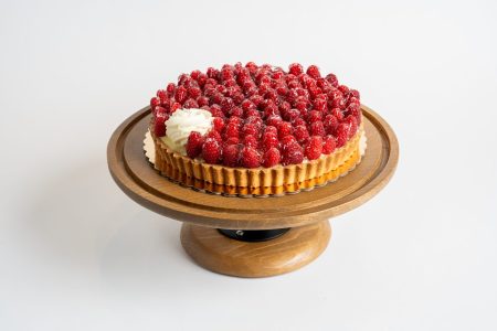 savor the classic flavor of a Lemon Raspberry Tart at Mia's Bakery.